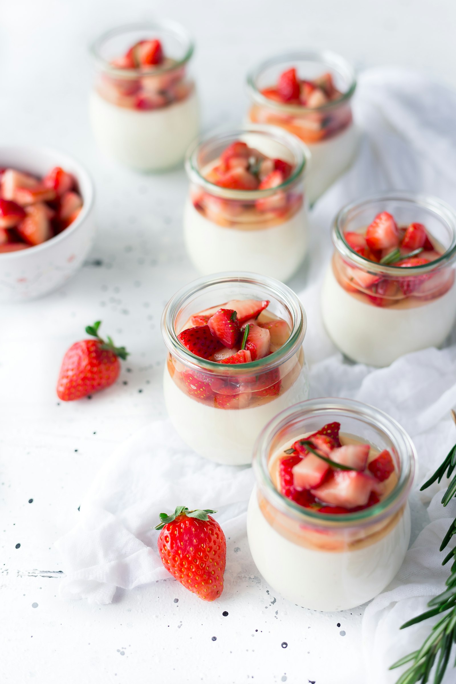 Individual tiramisu cups dusted with cocoa in small glass tumblers