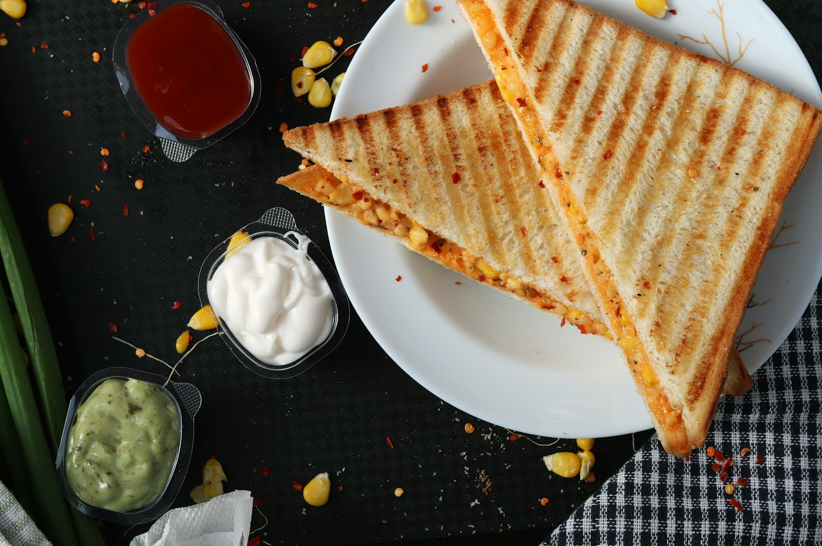Thick toast spread with whipped feta and topped with blistered cherry tomatoes
